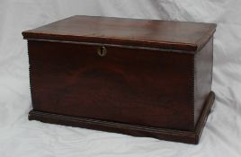 An 18th century ash coffer of small proportions with a hinged lid, the sides with cut out decoration