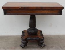 An early 19th century rosewood card table, the rectangular top with a baize interior on a leaf