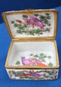 A porcelain snuff box and cover of rectangular form painted with a bird of paradise amongst leaves