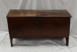 An 18th century oak coffer, the rectangular planked top above a single planked front and slab sides,