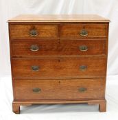 A 19th century oak chest, the rectangular planked top with a moulded edge above two short and