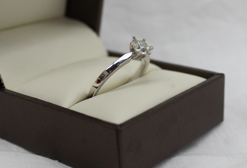 A solitaire diamond ring, the brilliant cut stone approximately 0.5 of a carat to an 18ct white gold