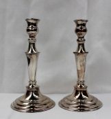 A pair of Elizabeth II silver candlesticks, of knopped form with a tapering column on a spreading