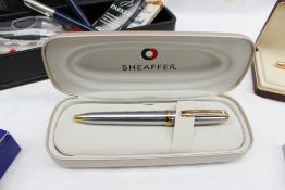 A Sheaffer white dot chrome ballpoint pen, together with a collection of fountain and ball point