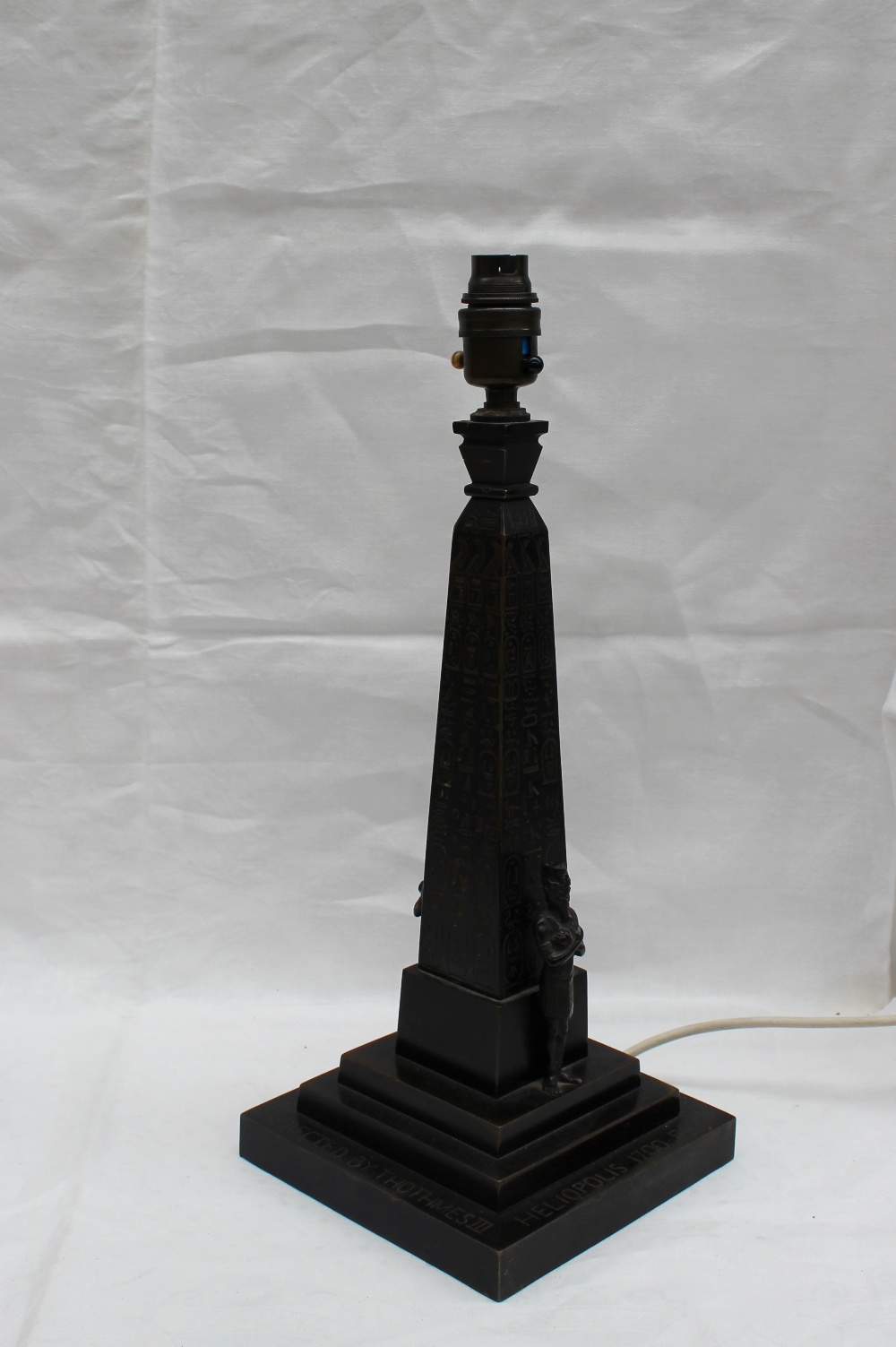 A bronze table lamp in the form of Cleopatras needle, 36cm high