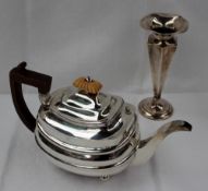 A George III silver teapot of oval ribbed form, with an ivory knop and treen handle, London, 1806,