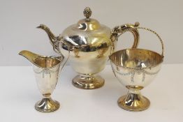 A George III silver teapot of inverted baluster form decorated with swags, London, 1773, Sebastian