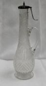 A late Victorian silver topped etched and cut glass claret jug, with a hinged lid with finger