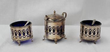 A George VI silver matched cruet set comprising a matching lidded mustard pot and two open table