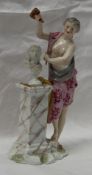A continental porcelain figure of a semi nude maiden sculpting a portrait bust, 22cm high
