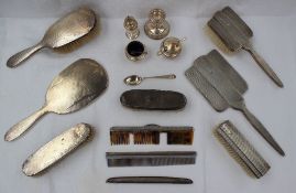 An Elizabeth II silver part dressing table set comprising a hand mirror, hair brush and clothes