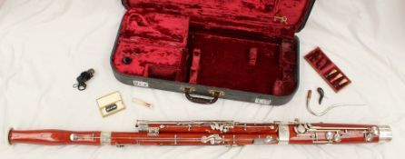 A Bassoon with plated mounts contained within a leather case