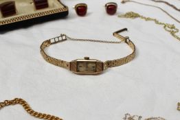 A 9ct yellow gold ladies wristwatch, the rectangular dial marked Everite, together with a quantity