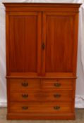 A 19th century satin walnut linen press, the moulded cornice above a pair of panelled doors, the