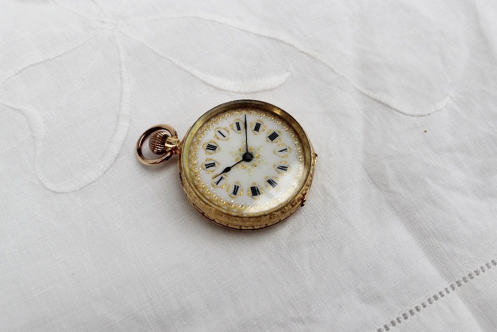 An 18ct yellow gold keyless wound fob watch, the enamel dial with Roman numerals and gilt