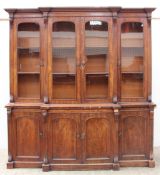 A large Victorian mahogany break front bookcase, the moulded cornice above four glazed cupboards