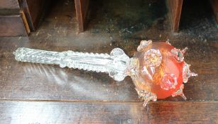 A coloured and clear glass ornamental mace, with orange ball end, the handle with ball decoration,