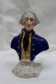 A 19th century pottery portrait bust of a naval officer in a blue frock coat and yellow waistcoat,