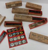 A collection of coloured Magic Lantern slides in boxes including circus scenes, Travel scenes,