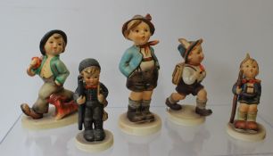 Five Goebel figures by M.J Hummel including Little Hiker, School Boy, Chimney Sweep, Strolling along