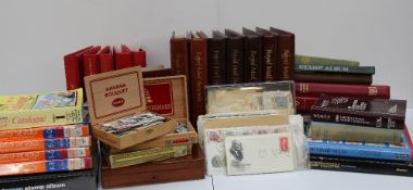 The improved stamp album containing world stamps, together with other stamp albums, first day