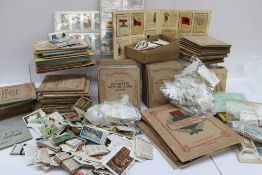 A large collection of cigarette cards including John Player & Sons, Wills, some loose and some stuck
