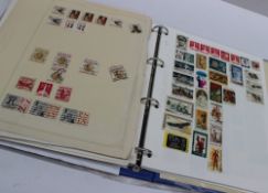A Grosvenor stamp album for philatelists containing world stamps on loose leaf sheets