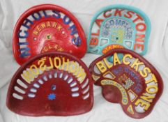 Four cast iron tractor seats all hand painted including two by Nicholsons, and two by Blackstone