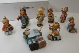 Eight Goebel figures by Berta Hummel including children with toys etc