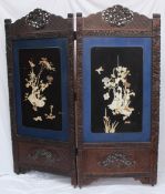 A Japanese ivory and mother of pearl inlaid two fold screen, the border carved with flower heads and