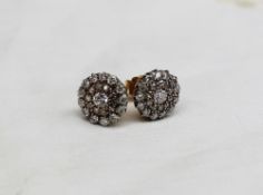 A Pair of diamond cluster  earrings, each set with twenty four round brilliant cut diamonds to a