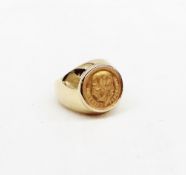 A Dos Y medio Pesos gold coin set ring dated 1945 in a yellow metal setting and shank marked 14k,