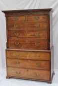 A 19th century mahogany chest on chest, the moulded dentil cornice with a blind fretwork border, the