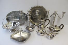 An electroplated four piece tea set together with candelabras, swing handled basket etc