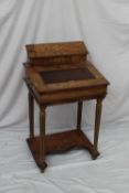 A Victorian walnut davenport, the raised superstructure with stationery compartment above a