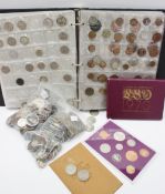 A coin album and loose coins, containing one shilling coins, two shilling coins, one florin,