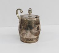 A George III silver mustard pot of barrel shape, the circular lid with acorn finial enclosing a blue