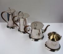An electroplated arts and crafts style four piece set comprising a hot water jug, coffee pot, teapot