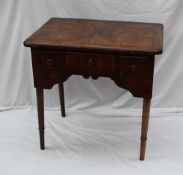 An early 18th century and later walnut lowboy, the rectangular top above three drawers and a