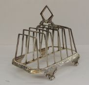 An early Victorian silver six division toast rack of rectangular form, the base decorated with