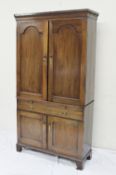 A 19th century mahogany linen cupboard, the moulded dentil cornice above a pair of cupboard doors