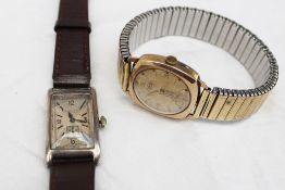 A gentleman`s silver wristwatch, the rectangular dial with a seconds subsidiary dial inscribed J