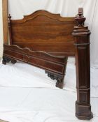 A 19th century continental rosewood bed, with camel back and turned finials, 154cm wide