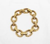 An 18ct yellow gold bracelet with oval textured links approximately 60 grams