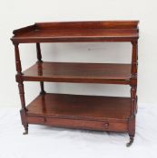 A Victorian mahogany buffet, the rectangular top with a three quarter gallery, above two shelves and