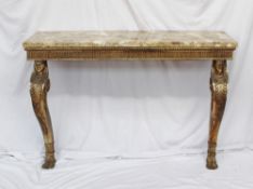 A console table, the variegated marble top above a gilt border on Egyptian head mono podia on