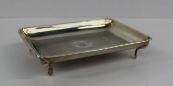 A George V silver pin tray, of rectangular form with engine turned decoration, the central