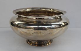 A George V silver pedestal bowl on a spreading foot inscribed "Presented to Capt A E M Sinclair