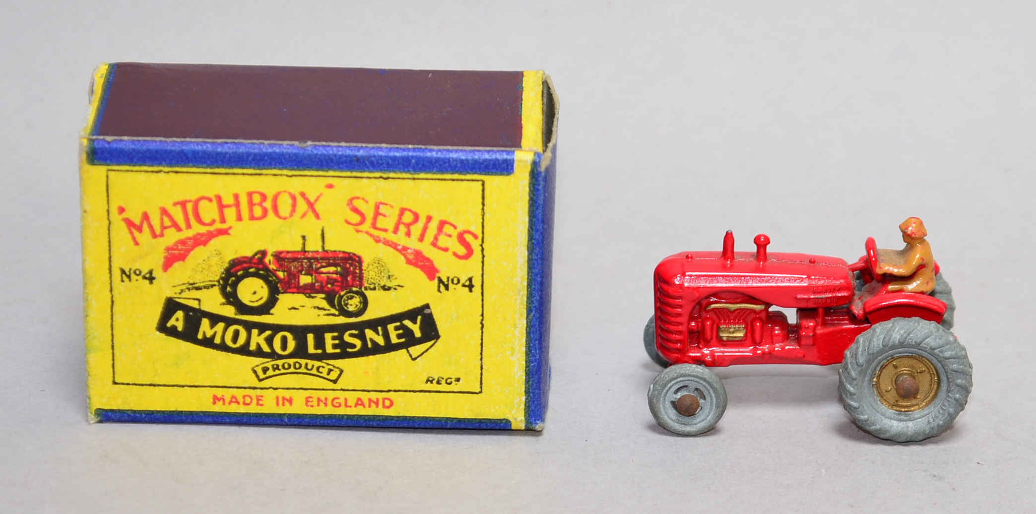 Moko Lesney Matchbox no. 4 Massey Harris Tractor in red with gold rear hubs. G/VG, some paint
