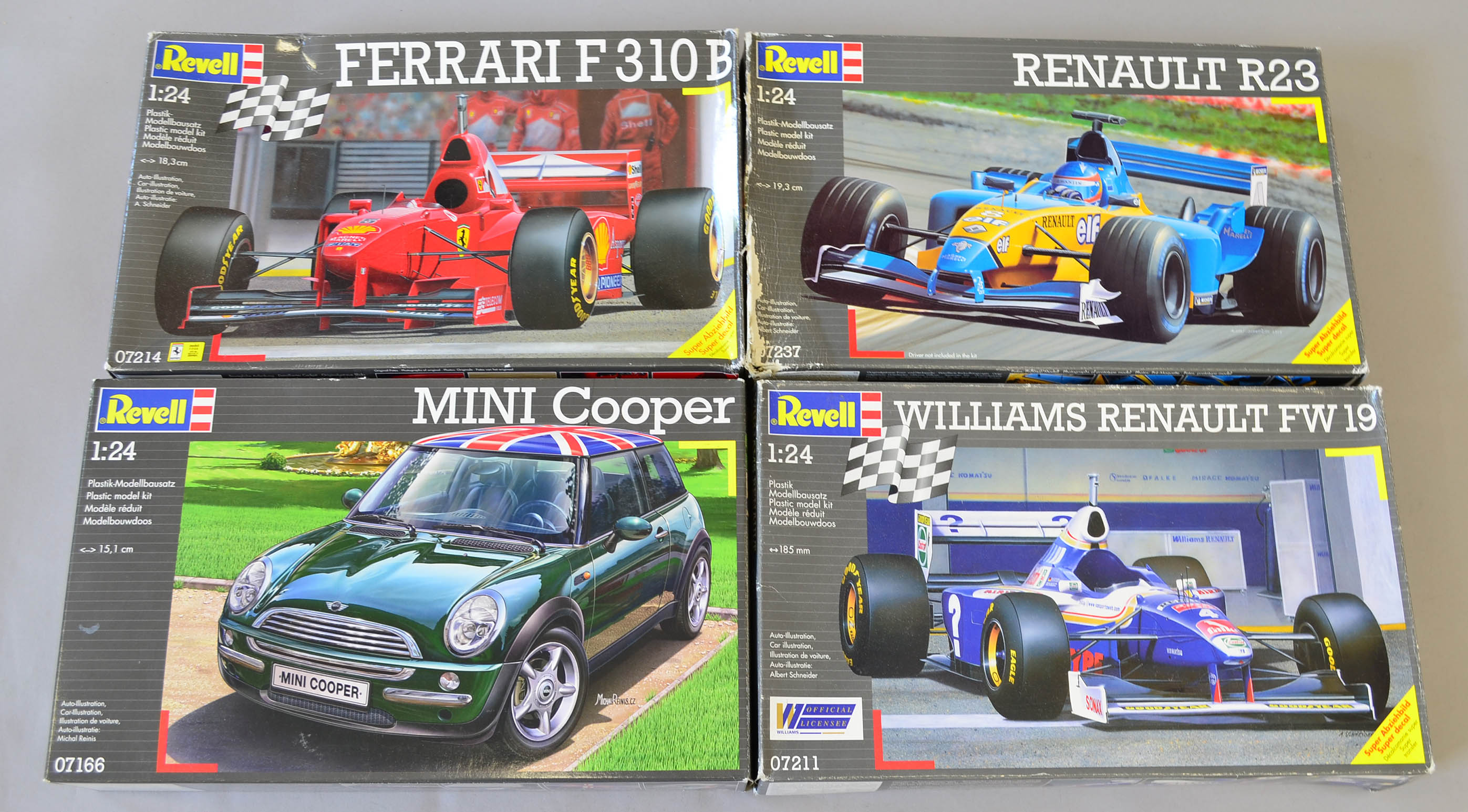 Four Revell plastic model kits, all cars: 07214 Ferrari F310B; 07166 Mini Cooper; 07237 Renault